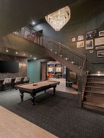 a games room with a pool table and a staircase at The Madison in OH 43215